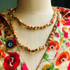 COLLANA  LUNGA HOUSE OF THUINA ARANCIONE